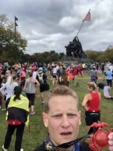 Dr. Hatch selfie showing off his MCM Medal at the Iwo Jima Memorial