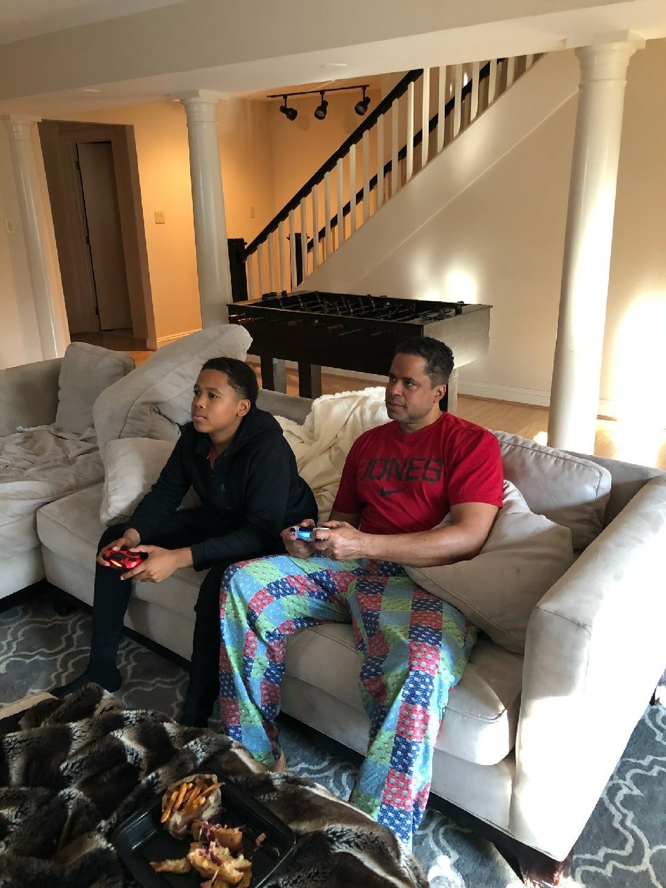 Dr. Booker and son Quint on the PlayStation.